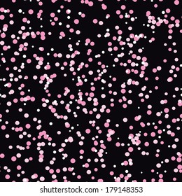 Seamless texture of pink circles on a dark background