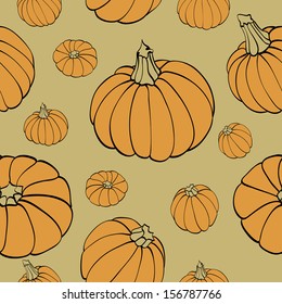 seamless texture with pumpkins on green background