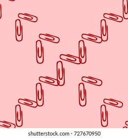 Seamless texture. Reds paperclips on a pink background