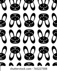 Seamless texture. Repeating, tile pattern with black rabbits, bunny, on a white background. It can be used as wallpaper, desktop, printing, wrapping, fabric or background for your blog, covers.
