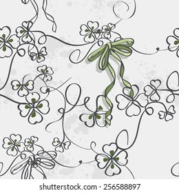 Seamless texture for St. Patrick's Day with clover leaves and bow