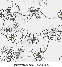 Seamless texture for St. Patrick's Day with clover leaves and bow