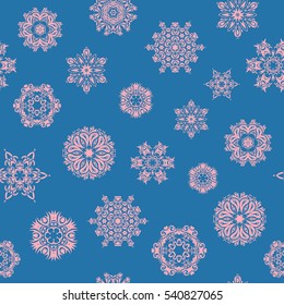 Seamless texture with stylized snowflakes and dots on a blue background. Starry Sky. Falling snow.