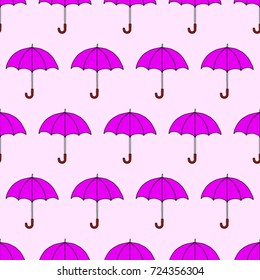 Seamless texture. Umbrellas on a pink background