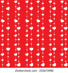 Seamless texture of white hearts on a red background