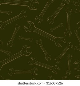 Seamless texture with wrenches on a dark background