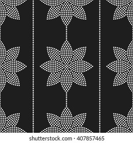 Seamless tiled black and white background of lotus flower and garlands. Dotted pattern. Vector Illustration.