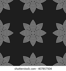 Seamless tiled black and white background of lotus flower. Dotted pattern. Vector Illustration.