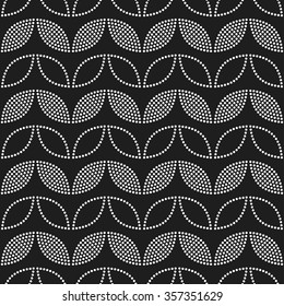 Seamless tiled black and white geometric background of leaves and petals. Grid. Dotted mosaic pattern. Vector illustration.