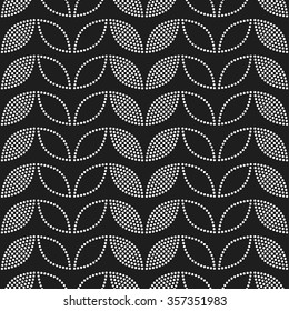 Seamless tiled black and white geometric background of leaves and petals. Grid. Dotted mosaic pattern. Vector illustration.