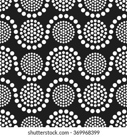 Seamless tiled black and white geometric wavy background of small and big circles in garland. Dotted pattern. Vector Illustration. 
