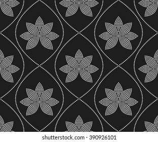 Seamless tiled black and white mosaic background of lotus flower and garlands. Dotted pattern. Vector Illustration.