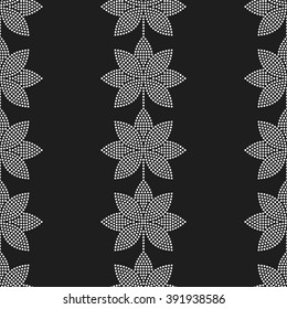 Seamless tiled black and white mosaic background of lotus flower in garlands. Dotted pattern. Vector Illustration.