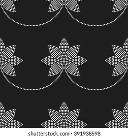 Seamless tiled black and white mosaic background of lotus flower in garlands. Dotted pattern. Vector Illustration.