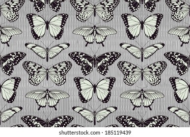 A seamless tiling repeating butterfly pattern background with beautiful butterflies