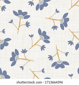 
Seamless tossed floral pattern in french blue linen shabby chic style. Hand drawn country bloom texture. Rustic woven background. Kitchen towel home decor swatch. Simple flower motif all over print