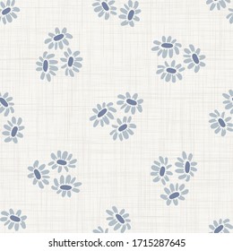 Seamless tossed floral pattern in french blue linen shabby chic style. Hand drawn country bloom texture. Rustic woven background. Kitchen towel home decor swatch. Simple flower motif all over print
