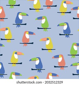 Seamless toucans abstract pattern. fashionable print for textiles and wallpaper. colored toucans on a branch . light blue background. vector texture.