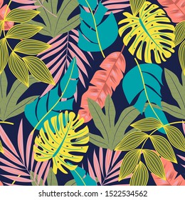 Seamless trendy tropical pattern with beautiful leaves and plants on dark purple background. Trendy summer Hawaii print. Beautiful seamless vector floral pattern. Tropic leaves in bright colors.