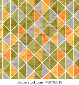 Seamless triangle pattern in green. Vector illustration.