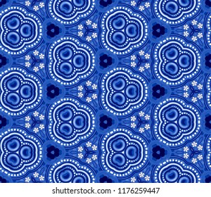 Seamless triangular pattern from white geometrical abstract ornaments on a dark blue background. Vector illustration. Suitable for fabric, wallpaper and wrapping paper