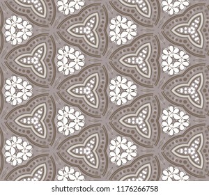 Seamless triangular pattern from white geometrical abstract ornaments on a beige background. Vector illustration. Suitable for fabric, wallpaper and wrapping paper