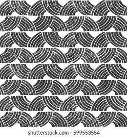 Seamless tribal pattern with grunge effect. Hand drawn background. EPS10 vector illustration in linocut style.