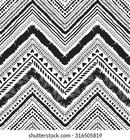 Seamless tribal zigzag pattern background that is hand-drawn with markers. Aztec creative illustration.