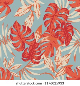Seamless tropical autumn color leaves blue background. Exotic trendy pattern flat cartoon wallpaper