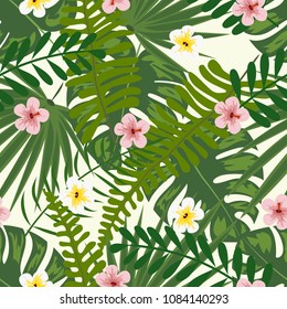 Seamless tropical floral pattern with hibiscus flowers, monstera and palm leaves.