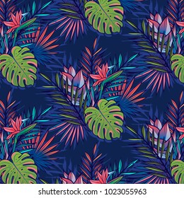 Seamless tropical and jungle pattern with palms, monstera leaves and other tropic flowers. Vector illustration.