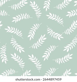 Seamless tropical leaf pattern with white foliage on soft green background. Ideal for fabric, wallpaper, eco packaging, botanical design, and natural theme illustrations. sstkBackgrounds