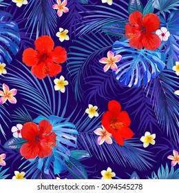 Seamless tropical motif with leaves and flowers