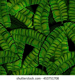 Seamless tropical pattern - banana leaves on a black background