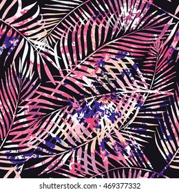 Seamless tropical pattern. Beautiful exotic abstract allover design. Palm leaves of different shapes on dark background, for fashion, interior, stationery, web.