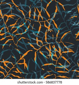 Seamless tropical pattern. Beautiful exotic abstract allover design. Palm leaves of different shapes on dark background, for fashion, interior, stationery, web.