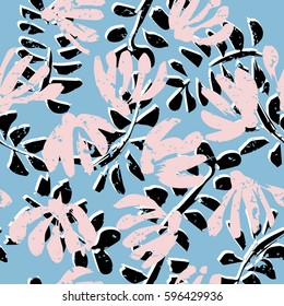 Seamless tropical pattern. Beautiful exotic abstract allover design. Palm leaves of different shapes on dark background, for fashion, interior, stationery, web