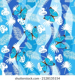 Seamless tropical pattern in blue tones. Large blue butterflies, white silhouettes of palm leaves, stylized waves as a background. Vector illustration. Motley print.