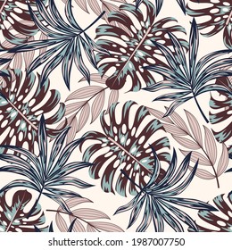 Seamless tropical pattern with bright colorful plants and leaves on a beige background. Seamless exotic pattern with tropical plants. Exotic wallpaper. Vintage pattern.