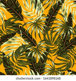 Seamless tropical pattern with green plants and leaves on a colorful yellow background. Hand draw texture. Vector template. Seamless exotic pattern with tropical plants. Hawaiian style.