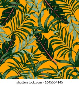 Seamless tropical pattern with green plants and leaves on a colorful yellow background. Hand draw texture. Vector template. Seamless exotic pattern with tropical plants. Hawaiian style.