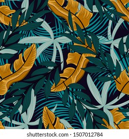 Seamless tropical pattern with green and yellow plants. Modern abstract design for fabric, paper, interior decor and other users, cover. Beautiful exotic plants. Trendy summer Hawaii print.