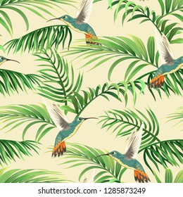 seamless tropical pattern with hummingbirds and palm leaves
