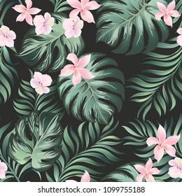 Seamless tropical pattern with jungle flowers and palm leaves. Summer print.