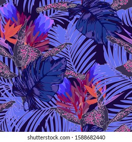 Seamless tropical pattern with leaves and exotic flowers.  Graphic vector background.
