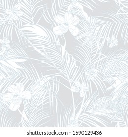 Seamless tropical pattern with leaves and exotic flowers.  Graphic vector background.