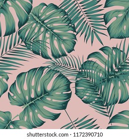 Seamless tropical pattern with leaves monstera and areca palm leaf on a pink background