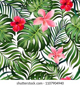 Seamless tropical pattern with palm leaves and hibiscus flowers. Jungle background. Botanical vector illustration.