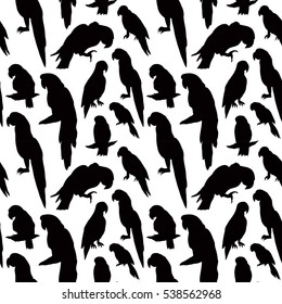 Seamless tropical pattern with parrot bird silhouette. Can be used for textile, website background, book cover, packaging.