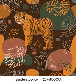 Seamless tropical pattern with tiger, leaves. African background. Design for wallpaper, textile design, packing, textile, fabric. Tropics, paradise, resort theme. Wild cat, feline